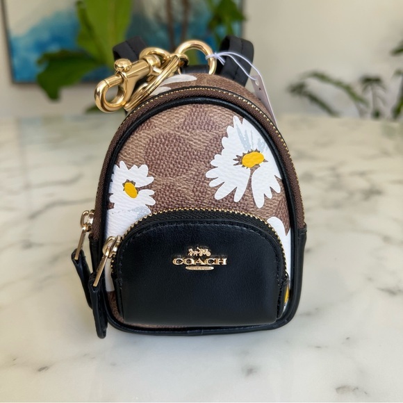 Coach Accessories - NWT COACH Mini Court Backpack Bag Charm In Signature Canvas Daisy Print CZ602
